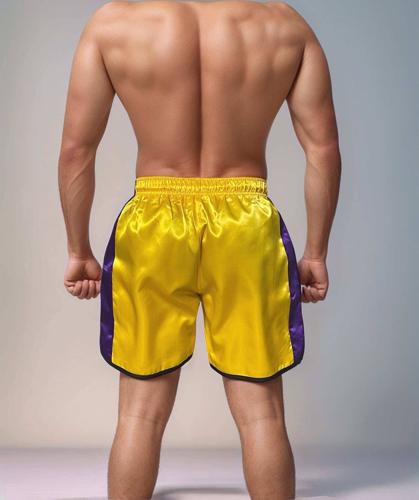 Glossy Yellow Sports Shorts with Purple Stripes.